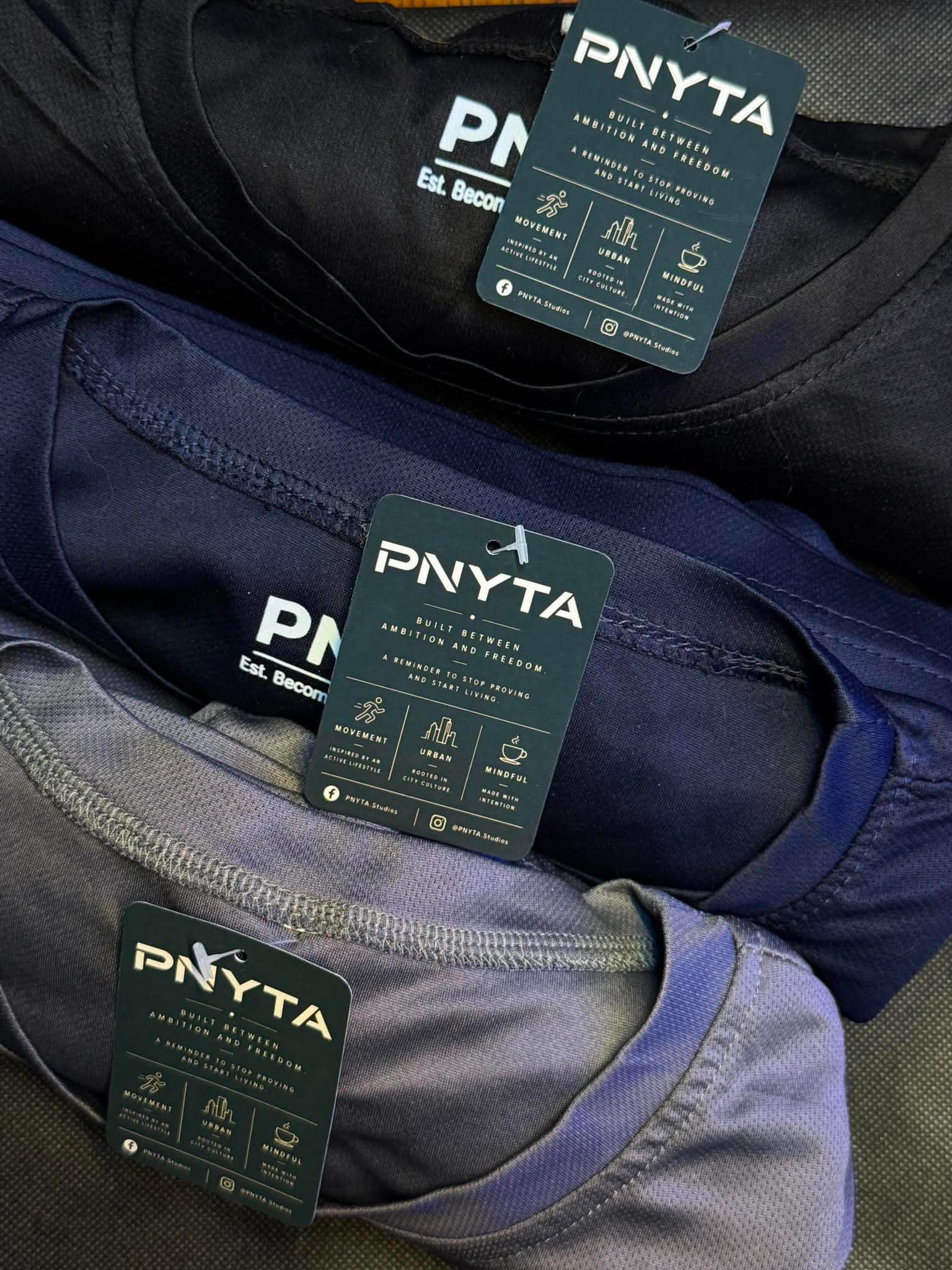 PNYTA hangtags on dry-fit shirts